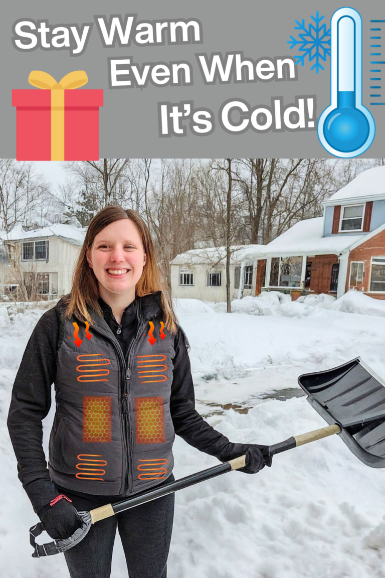 Woman wearing a heated vest for extreme cold weather, smiling outdoors, showcasing warm winter gear ideal for sub-zero temperatures.